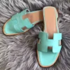 HERMES ORAN SLIDE SANDALS IN BLUE ATOLL SWIFT CALFSKIN - HMSD123
